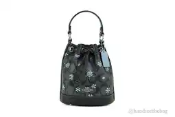 Walmart Coach (CE587) Dempsey 15 Small Snowflake Print Black Coated Canvas Bucket Bag offer