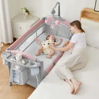 Walmart Babyomi Multifunctional Co-Sleeper Bassinet with Adjustable Height, Pink, with 3 Hanging Toys offer