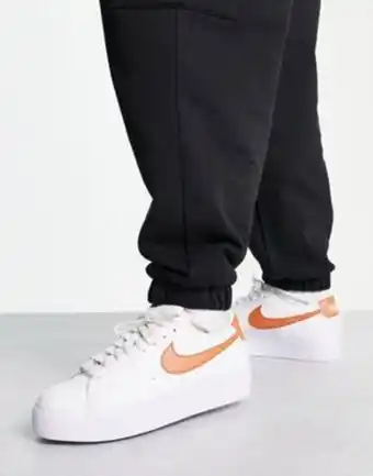 Nike blazer low platform trainers in white and metallic copper