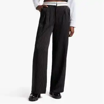 The FIX Women's black & white striped fold-over waistband pants offer