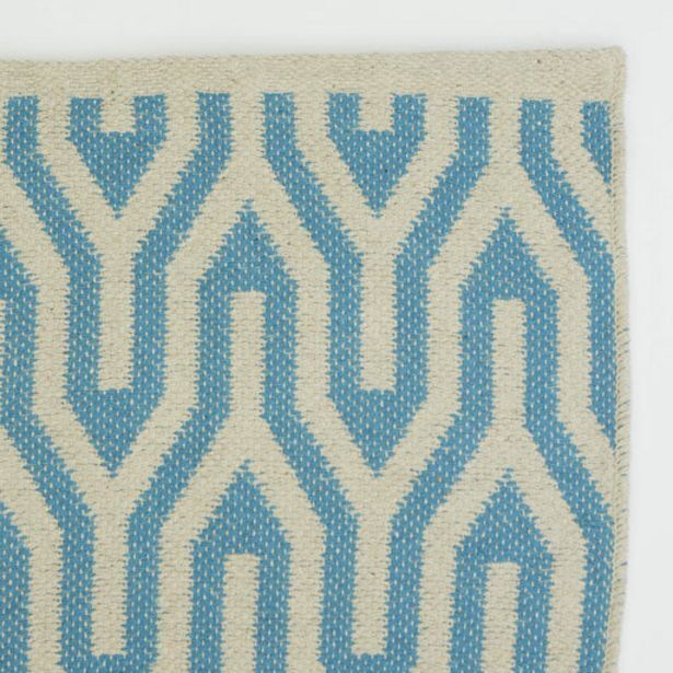 Hand woven geometric pattern rug turquoise offer at Whitehouse