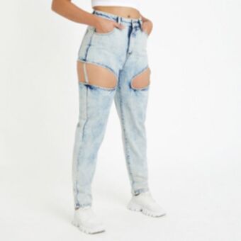 The FIX Women's light wash denim mom jeans with cut out detail offer
