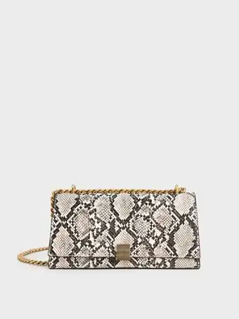 Charles & Keith Chain strap snake print trapeze shoulder bag - chalk offer